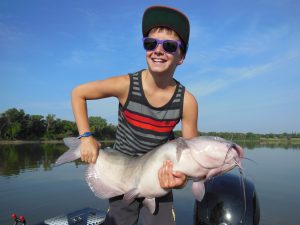 boy holding monster Channel Catfish