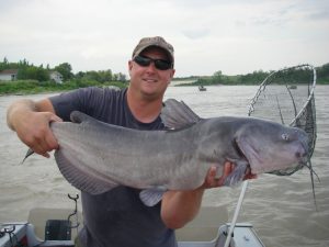 Man with large catfish catch